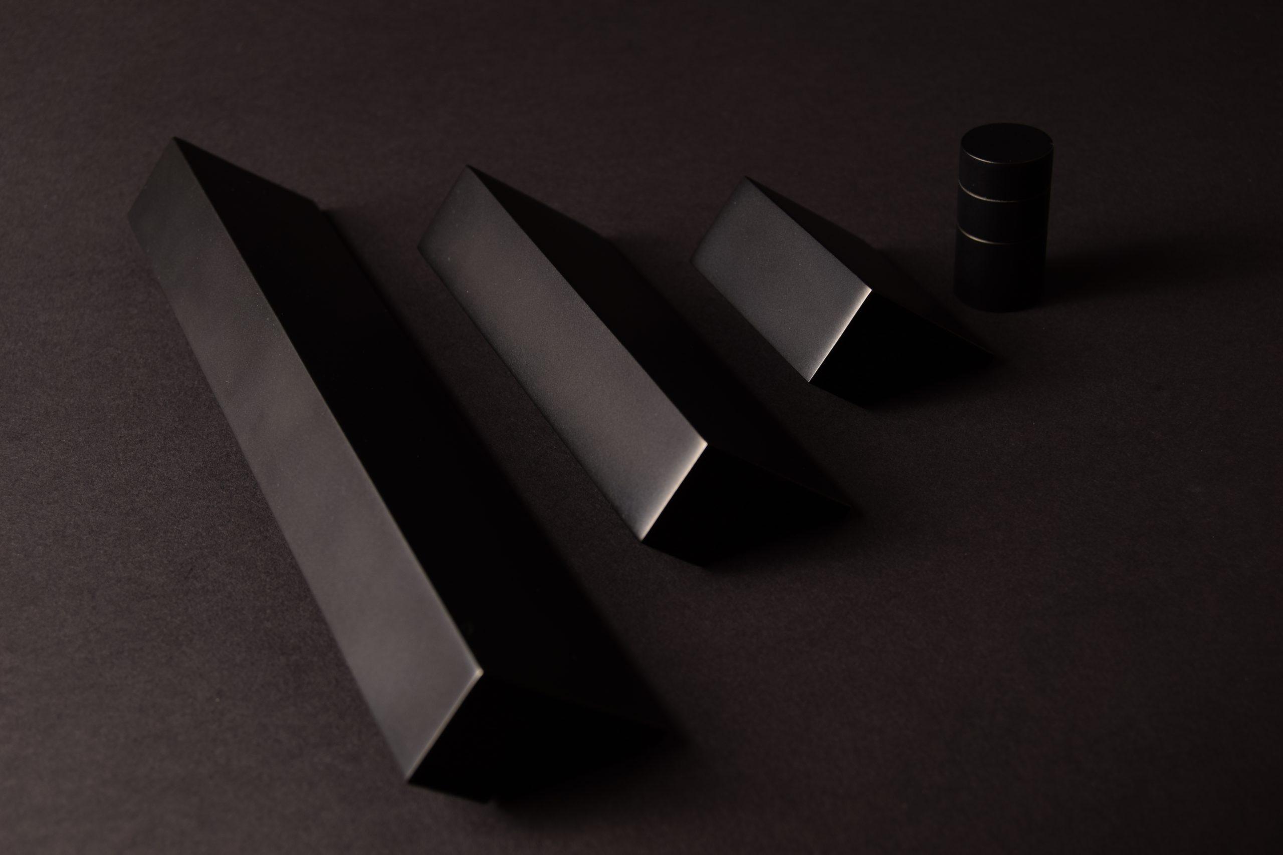 Image of a Solid ledge shown in a variety of three different sizes. Finished in a matt black chrome metal finish.