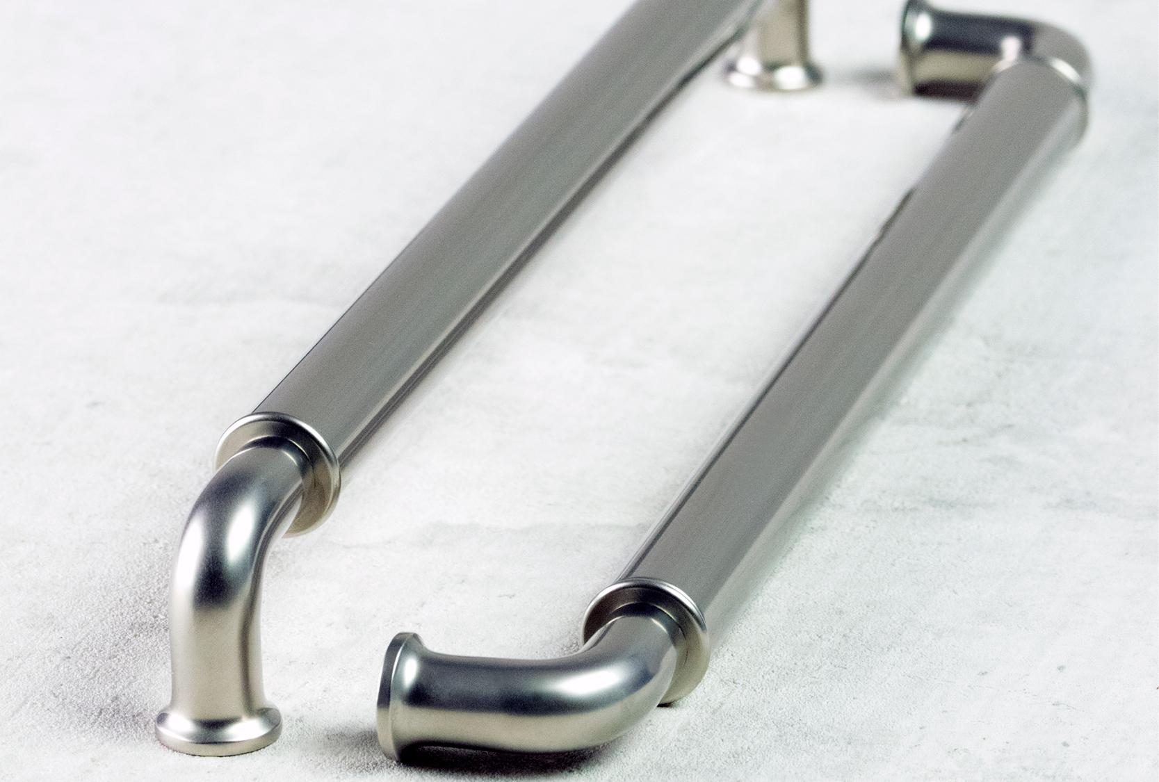Image of two goose neck barrel solid cabinet pull.