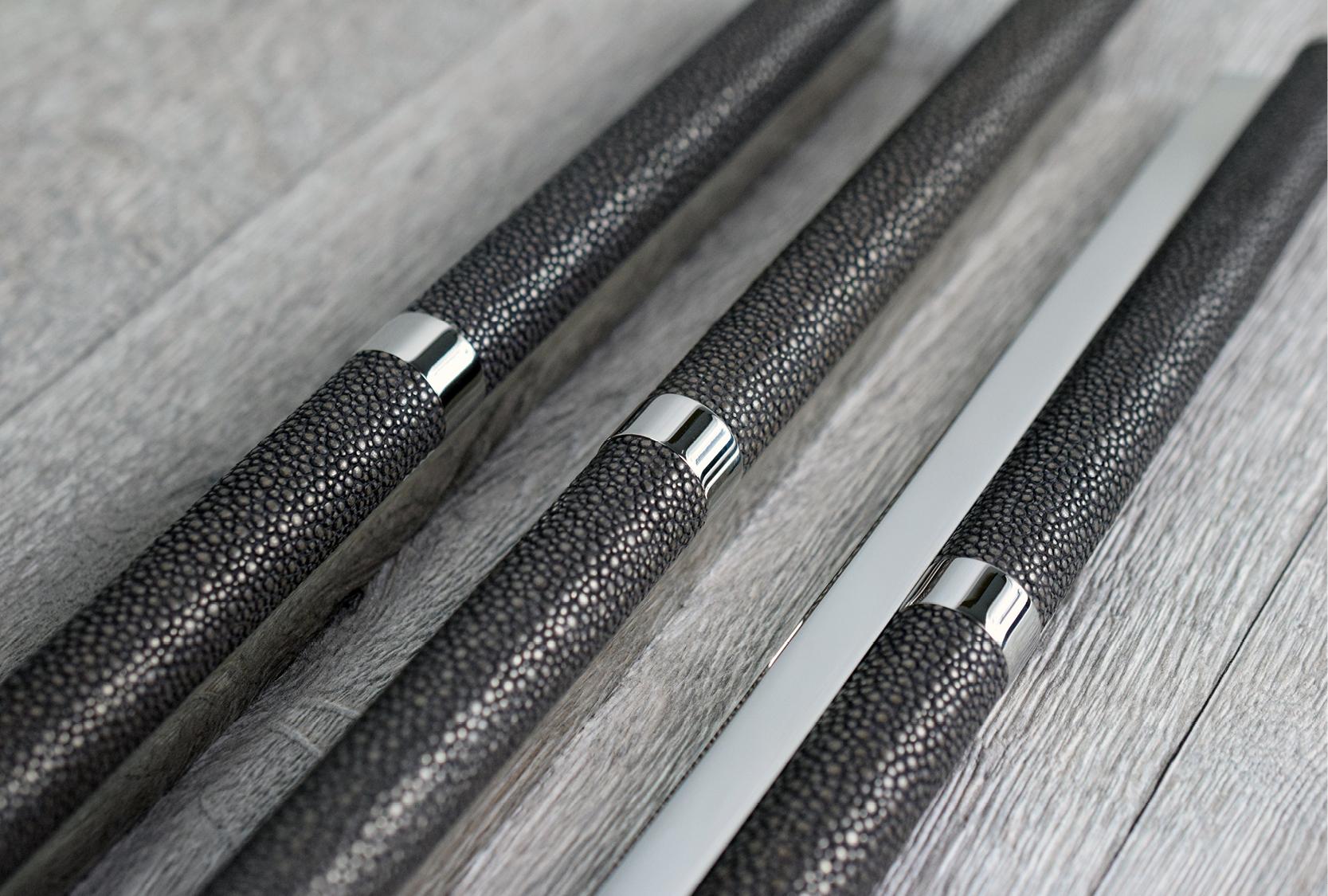 Image displays three custom shagreen design multi grip pull handles. The pull handle grip is finished in Alupewt with a bright chrome metal finish.