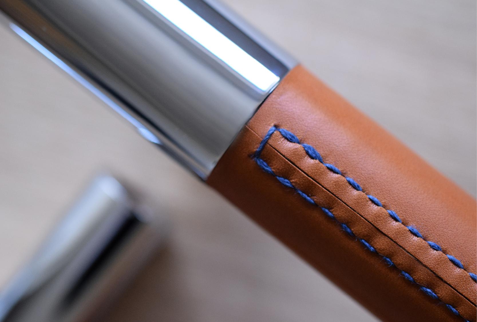 Custom large barrel pull handle with a chestnut leather and straight stitch with custom blue threads. The leather hardware is hand stitched in the Turnstyle Designs Devon based factory.