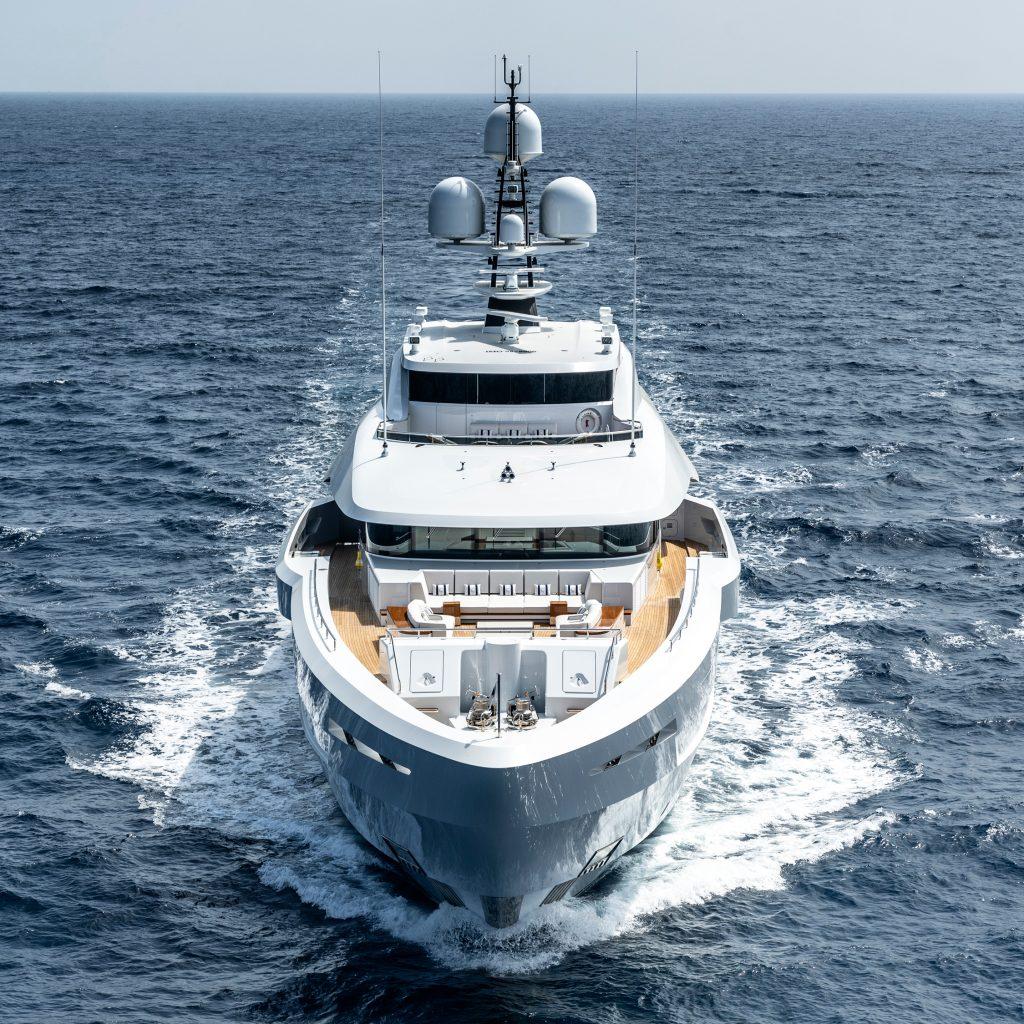 Motor yacht lusine making way along the open ocean. This is an exterior shot from the bow of the yacht.
